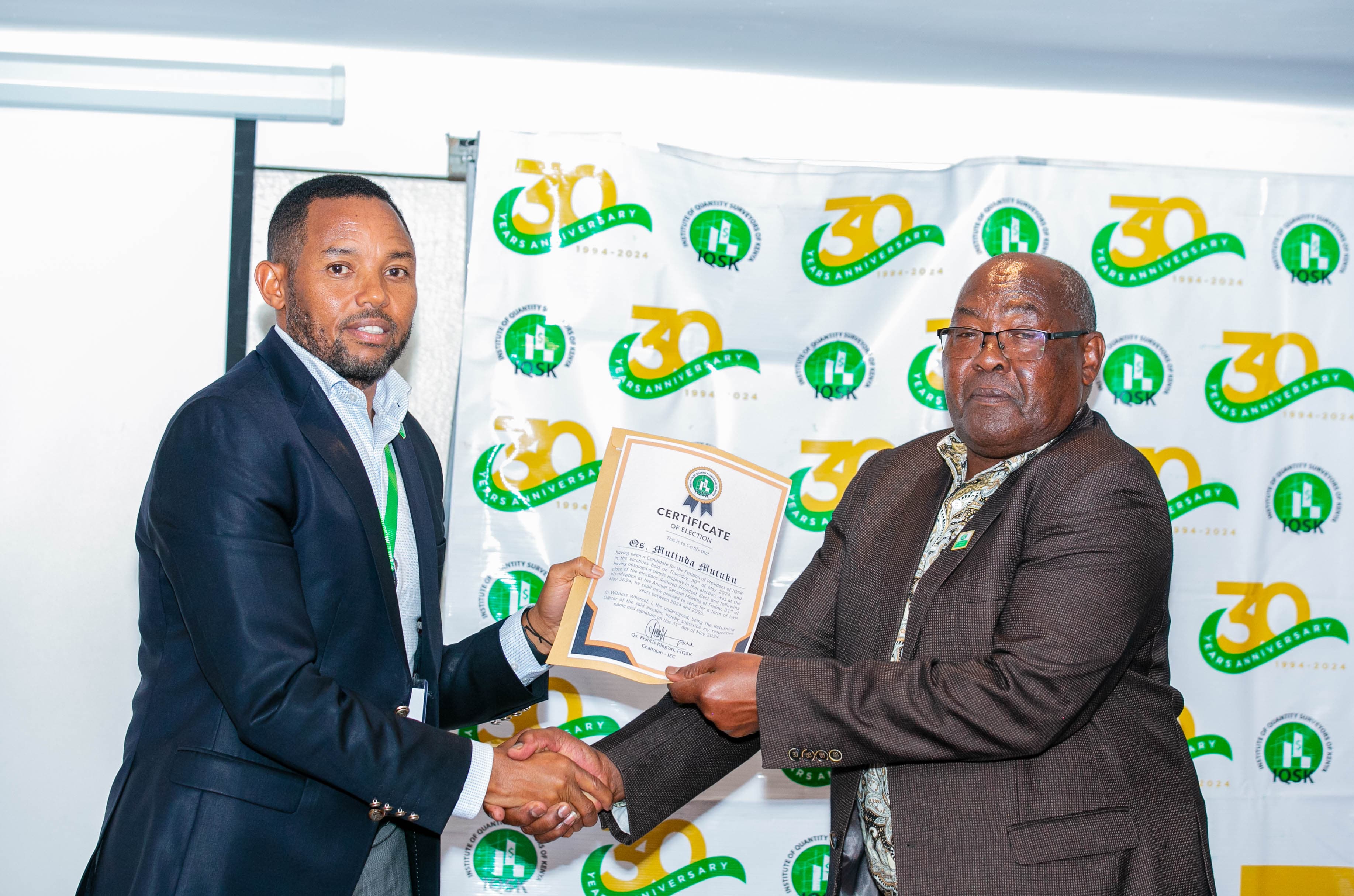 Qs. Mutinda Mutuku receives his Certificate of Election as President of IQSK from Commission Chairman Qs. Francis King'ori