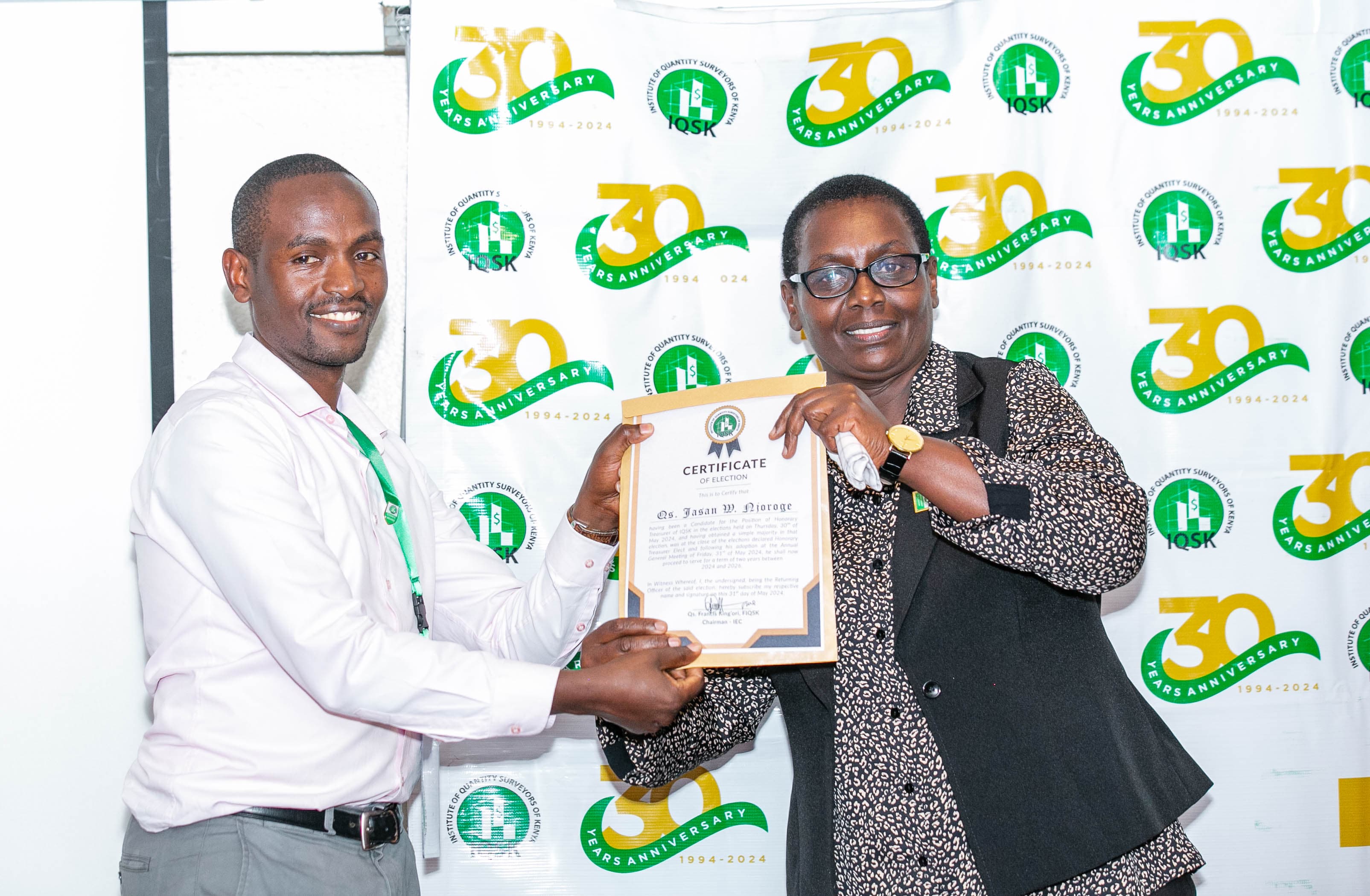 Qs. Jasan Njoroge receives his Certificate of Election from Commission Vice Chairperson Qs. Gladys Wahome