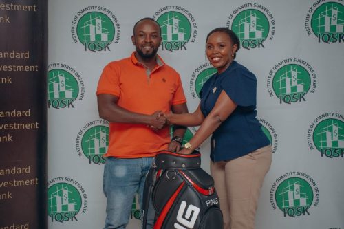 Overall Winner receiving his prize gift from the President Q.S Janet Chirchir